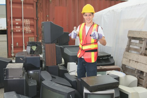 Business professionals managing waste in an office environment in Eltham