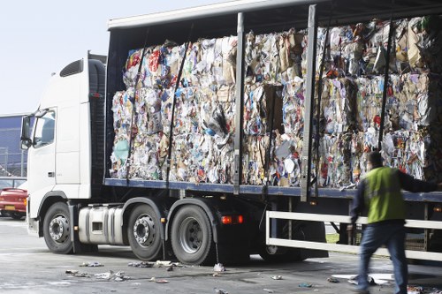Workers sorting recyclable materials at a local transfer station
